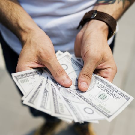 Hands Holding Money